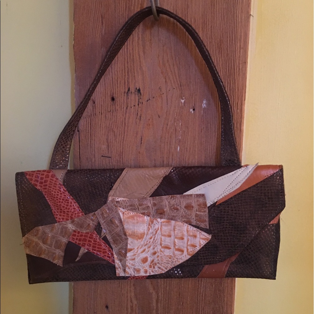 Custom handmade pre owned patchwork leather clutch with handle